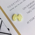 Close-up of translucent yellow resin bow DIY craft accessory with fine grooved textures - Yellow (8#)