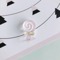 Macro view of a resin lollipop charm with pink spiral patterns and a yellow bow - 3#