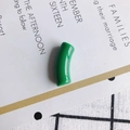 Detail view of a glossy green curved resin tube bead for DIY necklace and bracelet crafts - 10 Pieces Pack / Dark Green