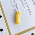 Macro shot of bright yellow translucent curved resin tube bead for DIY jewelry making - Bright Yellow