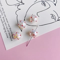 Macro view of colorful dotted faux pearl beads and flower DIY jewelry pins on a stylish card - Colorful Dots (4#)