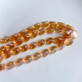 Gros plan détaillé de perles de cristal ovales ambre pour la création de bijoux DIY - Fil de Perles Facettées Ambre(1#)