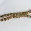 Vista macro de cuentas doradas en forma de estrella con acabado de espejo para DIY - Dorado Espejo (3#)