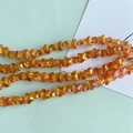 Macro detail of iridescent orange butterfly glass beads for DIY jewelry making - Iridescent Orange (2#)