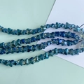Close-up of iridescent blue gradient glass butterfly beads for DIY jewelry making - Iridescent Dark Blue (3#)