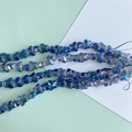 Macro view of iridescent blue butterfly glass beads for DIY jewelry and necklaces - Iridescent Lake Blue (7#)
