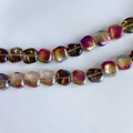 Macro detail of iridescent laser glass square beads with amber and purple gradients - Aurora Gradient Amber (18#) / Approx 60 Beads/Strand