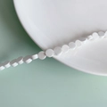 Macro shot of white ceramic flat round beads for DIY jewelry making accessories - White Flat Round Style (6#)
