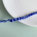 Macro detail of dark blue ceramic flat round beads for DIY handmade jewelry crafts - Deep Blue Flat Round Style (8#)