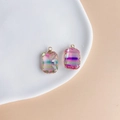 Detail view of rectangular gradient crystal pendants with gold plated edges on ceramic tray - Rainbow Iridescent (4#)