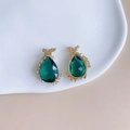 Close-up of teardrop green crystal pendant with gold fairy motif and zircon accents - Deep Green (5#)