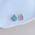Macro shot of teardrop-shaped crystal pendants with gold edges and AB gradient colors - Purple Green Blue Aurora Style (3#)