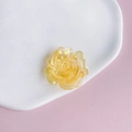 Macro view of iridescent yellow acrylic rose charms on a decorative white ceramic tray - 2# Iridescent Yellow