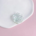 Macro view of iridescent acrylic rose flower charm on white ceramic display plate - 3# Aurora Iridescent White