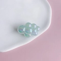 Macro shot of iridescent resin cloud charms with pearlescent finish for DIY jewelry crafts - Size 9