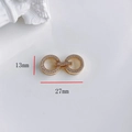 Vista macro di anelli da 27mm placcati in oro con zirconi per creazioni di gioielli - Chiusura Zirconia a Doppio Cerchio