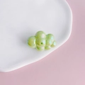 Close-up of iridescent light green cloud charm with a hole for DIY jewelry making - 18#
