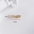 Macro view of gold-plated infinity link with cubic zirconia, sized 27mm by 6mm - Small Flower Buckle