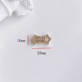 Dettaglio macro del connettore a stella dorato 20mm con zirconi per creazione gioielli - Fibbia Pentagramma