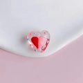 Macro shot of a clear heart-shaped DIY bead with hand-painted colorful polka dots and core - Transparent Pink Heart Polka Dot Style (6#)