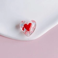 Macro detail of a transparent heart-shaped glass bead with red heart and arrow motifs - Transparent Arrow Through Heart Style (8#)