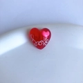 Detailed macro view of heart-shaped transparent resin bead with white love script print - Red Heart Love Letter Style (17#)