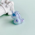 Detail of iridescent unicorn resin pendant with pearlescent finish on mint green backdrop - Iridescent Light Orange Style (4#)