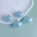 Macro shot of light blue pearlescent cloud charms with gold loops for DIY jewelry making - Pearl Light Blue Cloud (2#)