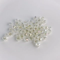 Macro shot of iridescent AB coated glass cube beads for DIY jewelry making - Aurora Transparent
