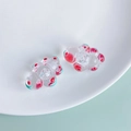 Macro detail of clear acrylic cloud charms with vibrant red dots and green swirls - Red Green Polka Dot Bubble Cloud (3#)