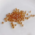 Close-up of amber square faceted glass crystal beads for DIY jewelry making - Champagne Gold