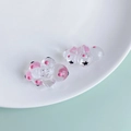 Detailed view of pink translucent resin cloud pendant with cute star eyes for DIY jewelry - Pink Cross Star Face Pendant (6#)