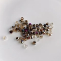 Macro view of geometric cube glass beads with polished facets and colorful refraction - Dark Brown AB