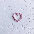 Detail of pink hollow heart charm with scalloped edges for DIY jewelry making - Hollow Pink Heart