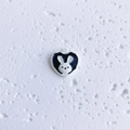 Detailed view of a black and white heart-shaped bunny pendant for DIY jewelry making - Heart Rabbit Black and White