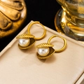 Detail of gold-plated starfish shell hoop earrings with pearls on jewelry box - Pearl Shell Earrings (Gold)