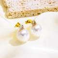 Elegant gold pearl stud earrings with zircon inlay shown on a luxury silk background - Four-Prong Rhinestone Pearl Stud Earrings (5717) / Gold
