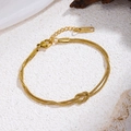 Golden double snake chain bracelet with a central love knot and adjustable lobster clasp - Double Snake Chain Knot Style (70108) / Gold