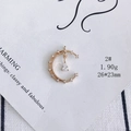 Macro detail of a 1.90g gold crescent moon pendant with micro-set zircons - Moon Droplet Style (2#)