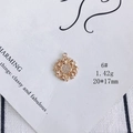 Macro shot of 20mm gold-plated sunburst charm pendant with sparkling white zircons - Hollow Sunflower Style (6#)