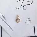 Detailed close-up of a teardrop gold pendant with large zircon and small crystal accents - Droplet Zirconia Style (10#)