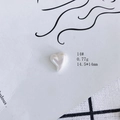 Macro shot of a heart-shaped resin accessory with iridescent pearl finish, 14.5x14mm - Iridescent Pearl White Heart (14#)