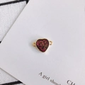 Close-up of heart-shaped glitter charms with gold edges and purple resin for DIY jewelry - Purple Red Glitter