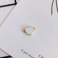Detailed view of heart resin charm with gold edges and dual loops for DIY jewelry making - Pearl White