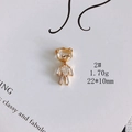 Detailed macro view of a gold-plated bear pendant with sparkling cubic zirconia stones - Zirconia Inlaid Bear (2#)