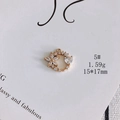Macro shot of gold-plated heart floral charm with cubic zirconia inlay, 15x17mm size - Flower Heart Circular Link (5#)