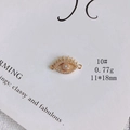 Macro view of gold-plated eye pendant with white zircon inlays and link loops - Eyelash Eye Connector (10#)