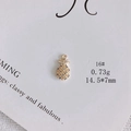 Macro shot of 18k gold plated pineapple charm with sparkling white zircon inlay - Pave Zirconia Pineapple (16#)