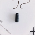 Macro view of a cylindrical resin bead with white marble texture on a decorative card - Large / 12# Black