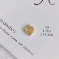 Macro view of heart-shaped gold-plated pendant with floral relief patterns, 13x11mm size - Botanical Embossed Heart (20#)